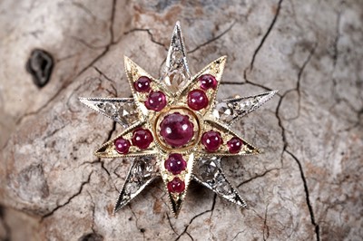 Lot 575 - A Victorian style ruby and diamond star pattern brooch