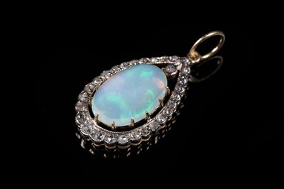 Lot 581 - An Edwardian style opal and diamond pendant