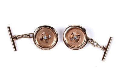 Lot 603 - A pair of diamond-set novelty button-pattern cufflinks