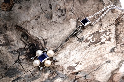 Lot 611 - An early 20th Century sapphire and pearl pendant