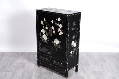 Lot 28 - An Oriental black lacquered cabinet