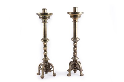 Lot 209 - A pair of 19th Century brass ecclesiastical candlesticks