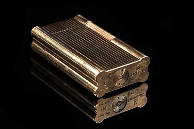 Lot 651 - A Rothschild Swiss made gold-plated lighter