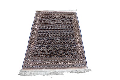 Lot 115 - A silk Persian rug