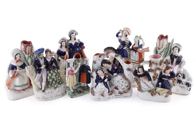 Lot 274 - A collection of Staffordshire figures
