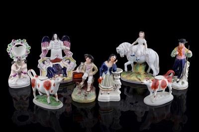 Lot 279 - A pair of cow creamers; and other Staffordshire