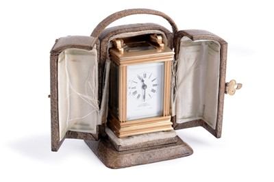 Lot 143 - Retailed by J C Vickery: a miniature gilt brass carriage timepiece