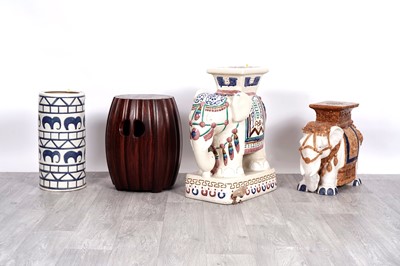 Lot 400 - Three Oriental stools; and a stick stand