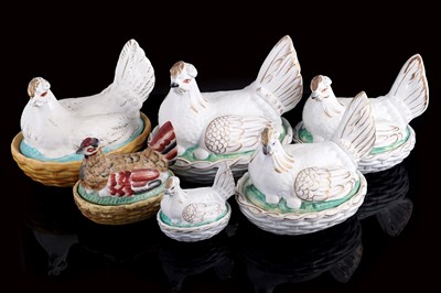 Lot 286 - A collection of Staffordshire egg baskets and covers modelled as chickens