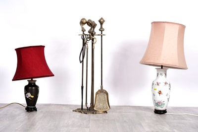 Lot 187 - Two table lamps; and a brass fire companion set