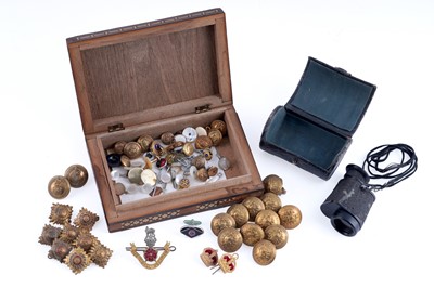 Lot 548 - A collection of military cap badges and buttons, and other items