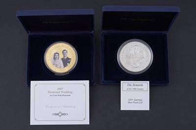 Lot 448 - A Westminster “2007 Diamond Wedding” proof coin; and a 2001 guernsey silver proof £10 coin