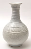 Lot 167 - Chinese white glaze relief moulded pear shaped...