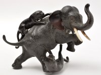 Lot 186 - A Japanese bronze group of elephant attacked...
