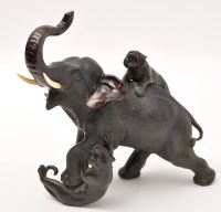Lot 187 - Japanese bronze group of an elephant attacked...