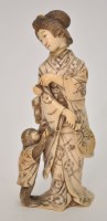 Lot 193 - Japanese ivory figure of a young lady feeding...