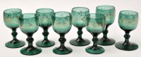 Lot 234 - Set of eight gilded green glass wine glasses...