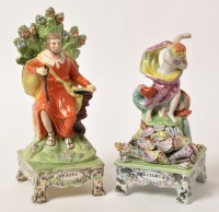 Lot 308 - Creamware figure of St. Paul, seated, beside...