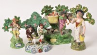 Lot 315 - Four Staffordshire figure groups with floral...