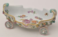 Lot 371 - Rococo form cart shaped basket on four wheels,...