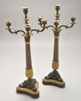 Lot 499 - A pair of brown patinated and parcel gilt four-...