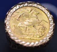Lot 556 - A Victorian gold sovereign, 1892, in 9ct. gold...