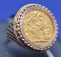 Lot 575 - A George V gold sovereign, 1915, in 9ct....