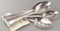 Lot 702 - Four George III silver dessert spoons, by...