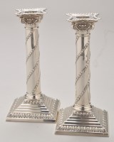 Lot 708 - A pair of Edwardian silver candlesticks, by...