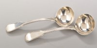 Lot 717 - A pair of George III silver sauce ladles, by...