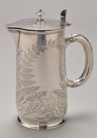 Lot 760 - An Edwardian silver hot water jug, by H.J Lias...