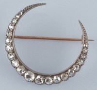 Lot 860 - A Victorian diamond crescent brooch, set with...