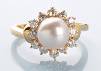 Lot 874 - A cultured pearl and diamond cluster ring, the...