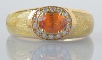 Lot 876 - A Faberge orange sapphire and diamond cluster...