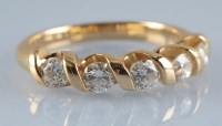 Lot 877 - A diamond ring, the five brilliant cut...