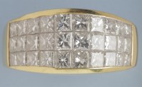 Lot 879 - A diamond dress ring, set with three rows of...