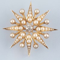 Lot 887 - A Victorian diamond and pearl star pattern...