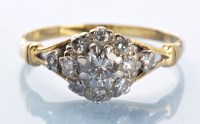 Lot 889 - A diamond cluster ring, the central brilliant...