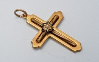 Lot 897 - A Victorian yellow metal crucifix pendant,...