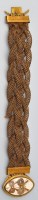 Lot 905 - A 19th Century plaited hair and yellow metal...