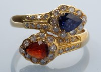 Lot 922 - A sapphire, ruby and diamond dress ring, each...