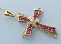 Lot 924 - A ruby and diamond crucifix pattern pendant,...