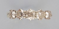 Lot 929 - A five stone diamond ring, the graduated...