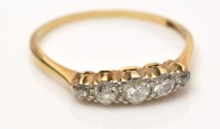 Lot 932 - A five stone diamond ring, the graduated...