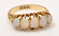 Lot 941 - A five stone opal ring, the graduated oval...