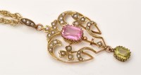 Lot 943 - An Edwardian drop pendant, centred by oval...