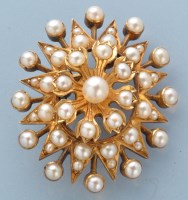 Lot 948 - A late 19th Century pearl star pattern...