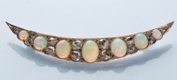 Lot 953 - A Victorian opal and diamond crescent form...