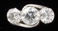 Lot 957 - A three stone diamond ring, the central old...