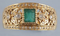 Lot 958 - An emerald and diamond dress ring, the...